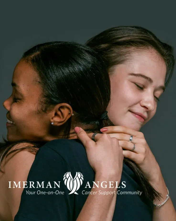 2 woman embracing each other with care